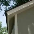 Installed Meridian 8 ft. x 10 ft. Wood Storage Shed with Autumn Brown Shingles image 5